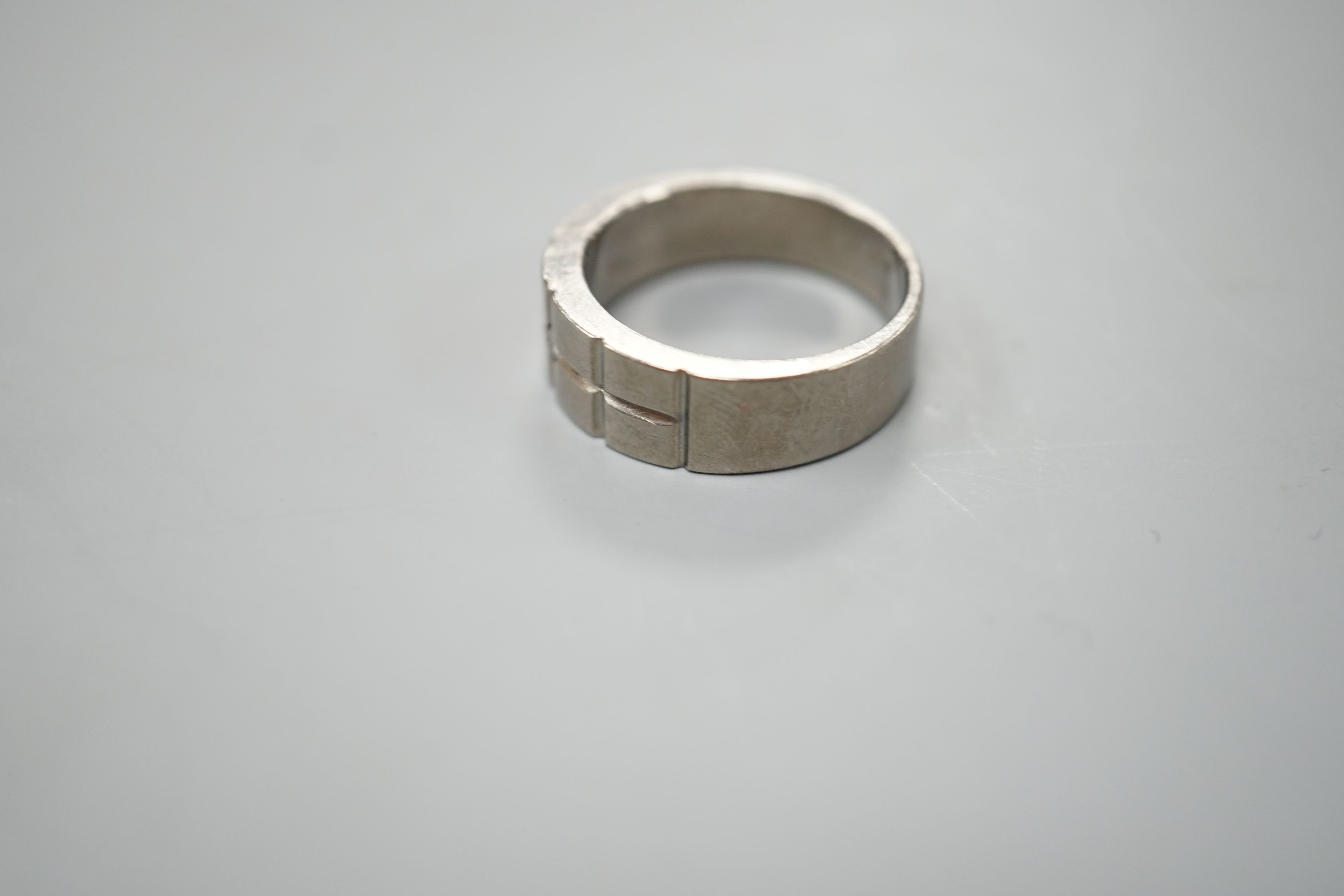 A diamond set titanium dress ring, size P, gross 3.3 grams